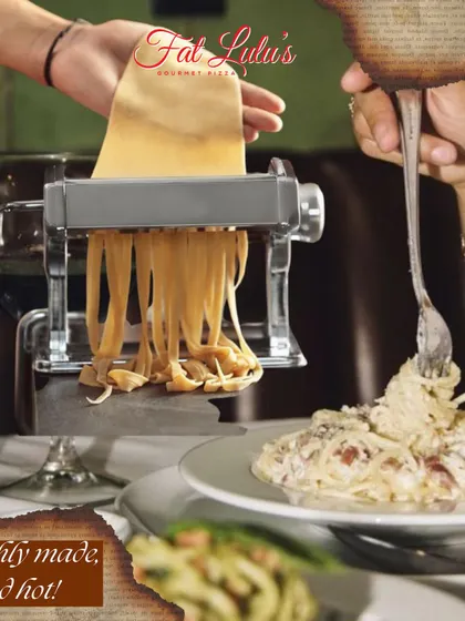 Here's a scene from a workshop where participants get to use a tabletop pasta machine to roll out their dough, right before enjoying a fresh plate of pasta.
