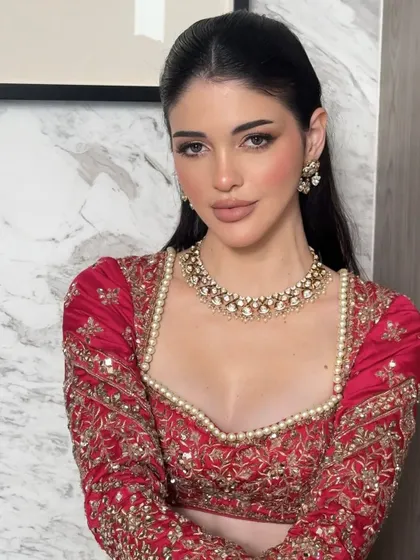 This portrait shows the beautiful structure the soft glam makeup provides, with subtle contouring and highlighting that sculpts the face naturally.