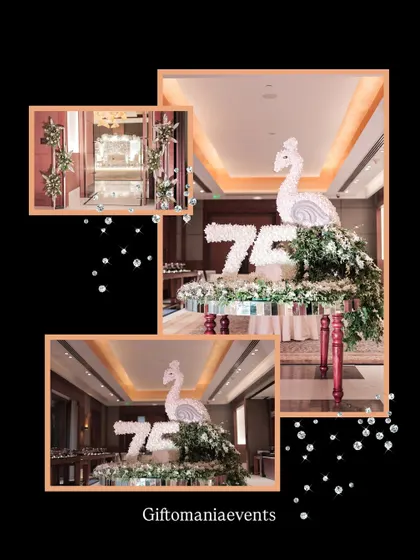 A bespoke floral sculpture created for a 75th birthday. This centerpiece features a peacock crafted from white flowers, perched atop the number '75' also made of flowers, demonstrating my ability to create unique, artistic floral installations.