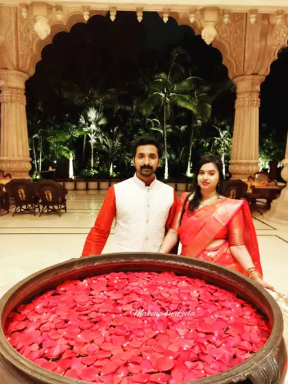 A couple enjoying their anniversary celebration at a beautiful venue. The client's makeup is elegant and suitable for a romantic evening out.