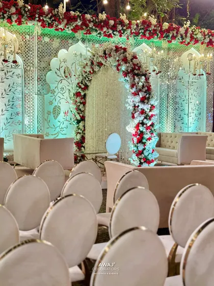 A view from the guest seating, showing the beautiful stage and the elegant arrangement of chairs for the attendees.