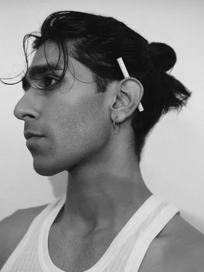 A simple, clean black and white profile shot. This type of image is essential for a model's book to show their features clearly.