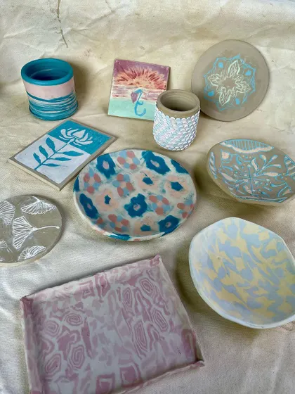 A duplicate of image 13, showcasing the colorful and diverse results from our workshops. These pieces are all food-safe, microwave-safe, and ready to be used and loved.
