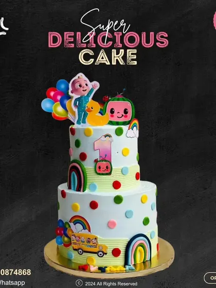 A grand two-tier Cocomelon cake that's full of fun. Decorated with colorful polka dots, rainbows, and all the main characters, this cake is a showstopper for a first birthday party.