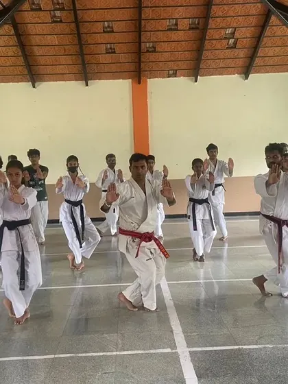 Synchronized training during a senior Kata session. The instructors lead by example, ensuring every student understands the finer details of the form.