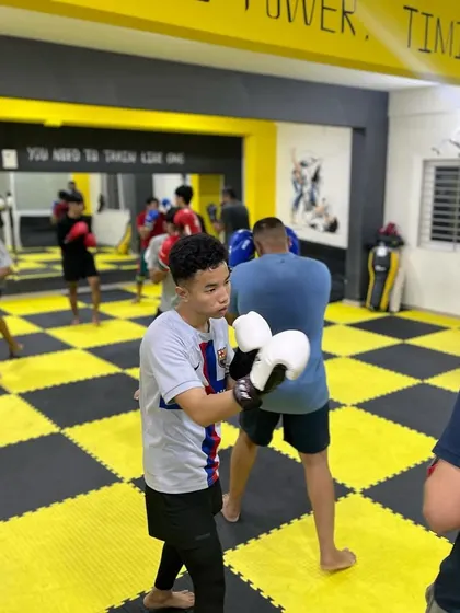 Another angle of our boxing class, showing members of all ages and skill levels practicing their form.