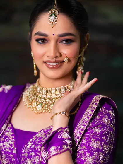 A close-up on the makeup, featuring a unique turquoise kajal that makes the eyes pop. A great way to add a touch of unexpected colour.