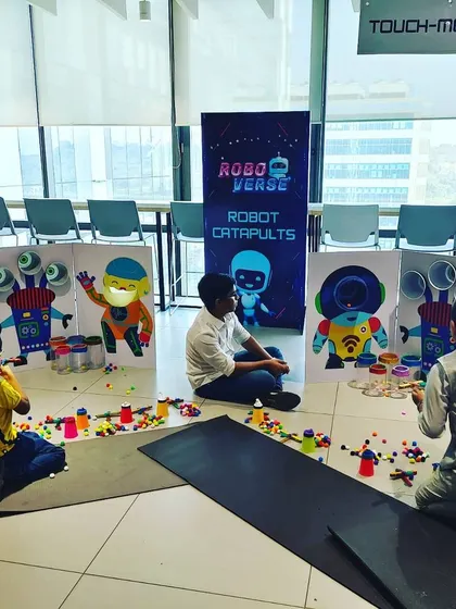 The robot catapult station, where kids can launch soft pom-poms at fun robot targets. We design our games to be colorful, engaging, and perfectly suited for children.