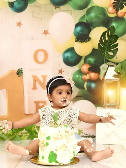 The aftermath of a fun cake smash! This little one is covered in cake and happiness, a perfect way to remember her first birthday.