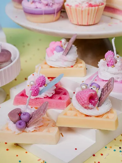 These waffle slice candles are one of my favorite creations. Each one is topped with piped whipped wax and detailed little fruit and chocolate embeds, making them a colorful and fun decorative piece for any kitchen or living space.