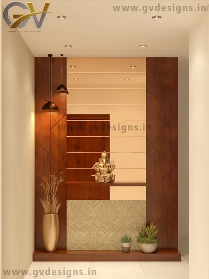 This foyer design uses a combination of wooden panels and a bronze mirror to create a frame-like effect. The space is designed to welcome guests with a Ganesha idol, warm pendant lighting, and a mix of plants and vases.