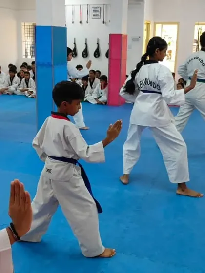 An instructor observes the class.