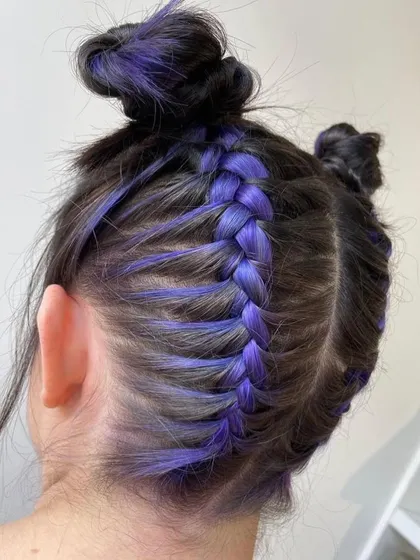This is a "Peekaboo Purple" look, perfect for clients who want a pop of color that can be hidden or shown off. The purple braid looks incredible against the dark hair.