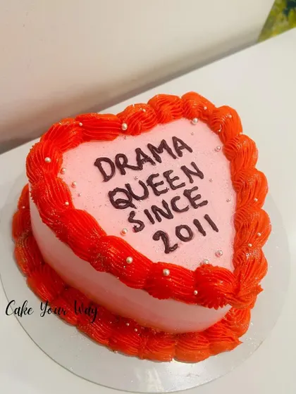 A sassy heart-shaped cake for the "Drama Queen Since 2011."
