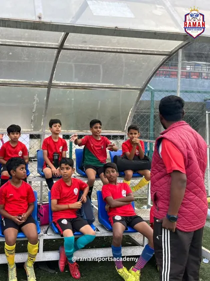 Our U11 squad receiving tactical instructions from their coach in the dugout during the JSW Youth Cup.