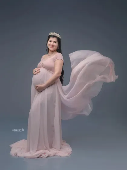 A soft pink gown with a flowing train is a classic and feminine choice. I add a gentle wind effect to the fabric to create a sense of movement and grace.