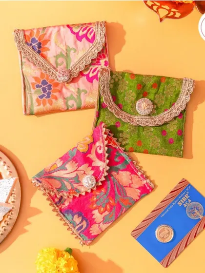 These small, colorful pouches with a decorative button are another beautiful option for presenting shagun coins or other small favors.