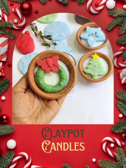 A look at my Christmas-themed clay pot candles, featuring designs like a wreath, star, and Christmas tree.