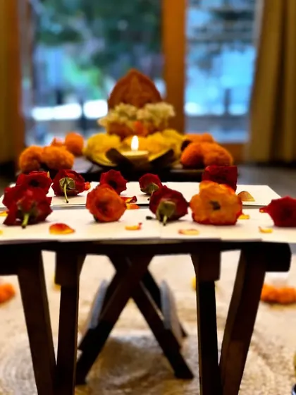 The altar set up for our Anubhuti Yoga Retreat, adorned with flowers and a candle. This space serves as a focal point for our intentions and a symbol of the light we cultivate within.
