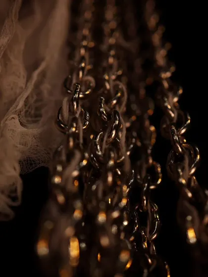 A close-up of the intricate set design for our production of "Medea." Chains and fabric are used to create a visceral and symbolic landscape.