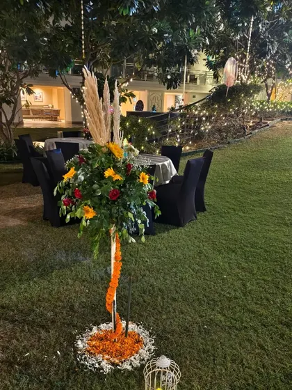 A floral standee used as decoration for an outdoor Diwali event, placed on the lawn.