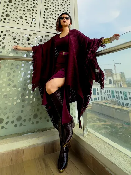 A final dramatic pose in the burgundy outfit. This is a perfect example of an editorial-style look.