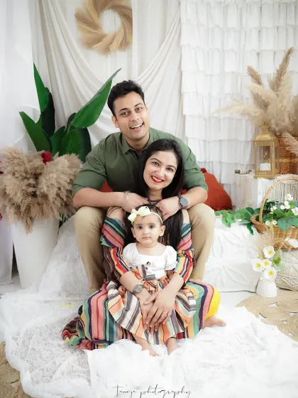 A fun and happy family portrait celebrating their baby girl. I love capturing the unique dynamic of each family, from tender moments to playful smiles.