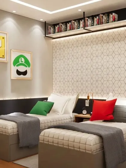 A view of the twin beds in the Mario-themed room, with a custom-built bookshelf above.