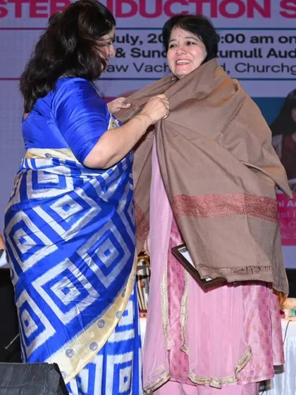 Being felicitated with a shawl, a traditional sign of respect, during the university's induction ceremony.