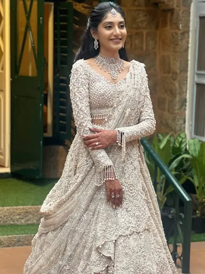 This is a perfect example of a dreamy, modern bridal look. The makeup is soft and romantic, with a sleek ponytail that adds a contemporary edge. This is a style you will learn to create.