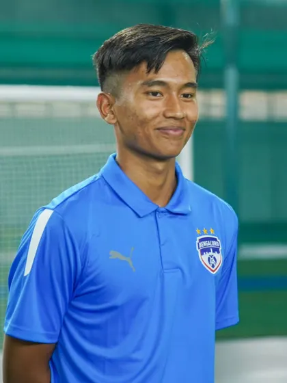 A smile from Namgyal Bhutia as he interacts with young fans and players at the Insportz Arena.