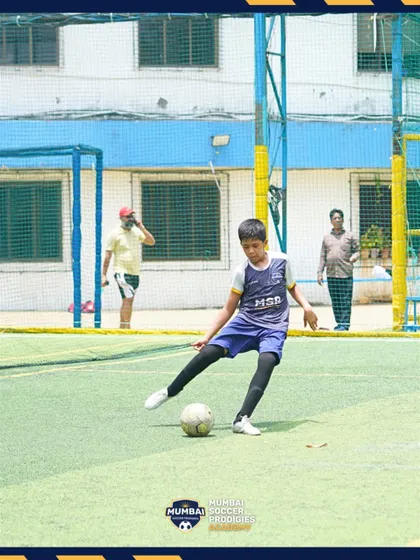 A player prepares to strike the ball, showing good form and technique.
