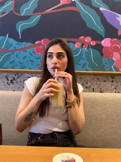 Another shot of me enjoying my iced coffee.