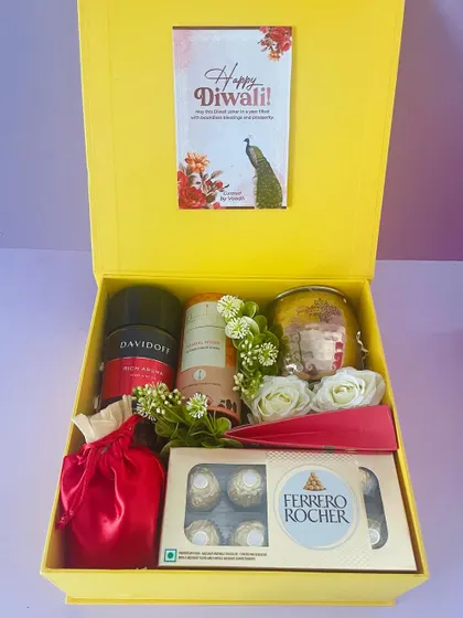 This yellow gift box was customized for a client, featuring premium items like Davidoff coffee, Ferrero Rocher, and a scented candle.