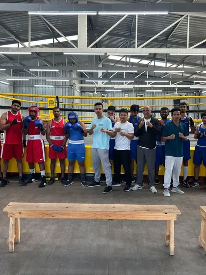 The group of competitors and coaches after a successful sparring competition at the gym. It's all about community and shared passion.
