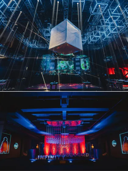 The 'Infinity & Beyond' theme extended throughout the venue, with red and blue lighting creating a futuristic mood. A suspended kinetic cube served as a central visual anchor for the event.