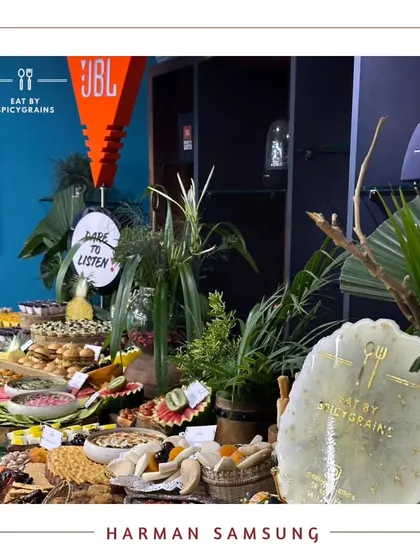A vibrant grazing table we set up for a Harman Samsung corporate event. The tropical-themed decor and diverse food options made it a memorable experience for the employees.