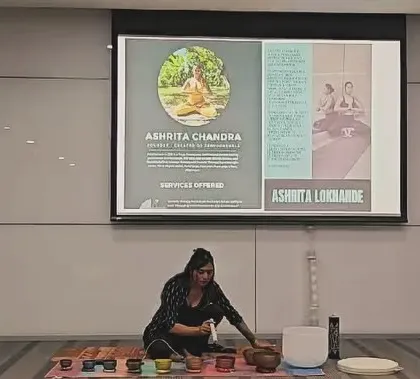 My setup for the corporate wellness event at ABB, with my presentation on the screen behind me. I combine practical information with experiential practice to create a holistic session.