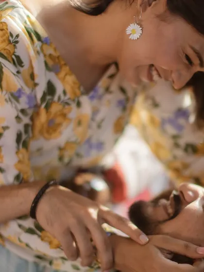 A moment of pure joy and laughter during a sunny picnic. These are the unposed, candid shots that tell the real story.