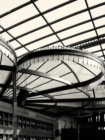 The overlapping forms of the canopy lights, viewed from below. This abstract perspective highlights their sculptural quality.