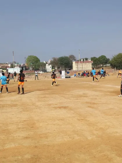 A practice match in progress on the dirt field during the trials. This simulates real game pressure and helps us assess players' decision-making skills.