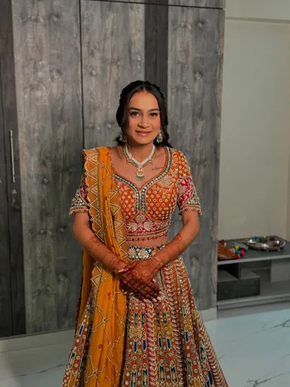 A full-length view of the bride, looking happy and radiant for her engagement. The entire look is a beautiful blend of tradition and modern style.