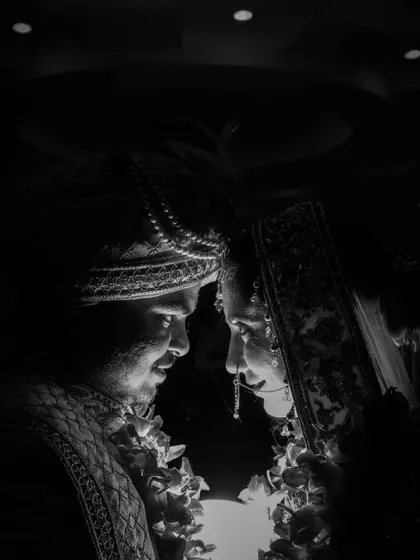 Sometimes, the most powerful emotions are captured without color. This intimate black and white portrait of the bride and groom shows my style of using dramatic lighting to create a timeless, emotional image focused purely on their connection.