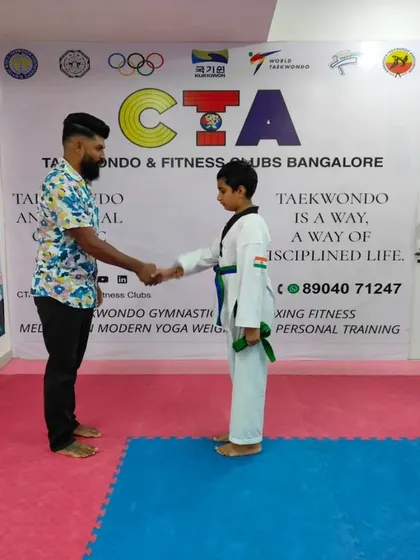 A handshake for a new green belt.