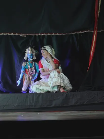 A live performance of 'Giridhar Naagar Ki Meera' at the Meera Mahotsav in Dwaraka, Gujarat. Here, a dancer performs alongside the puppet of Lord Krishna, creating a beautiful dialogue between the human and the divine.