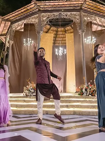 A surprise entry by the groom during his sisters' performance. This was a fun twist that got a huge applause from the audience.