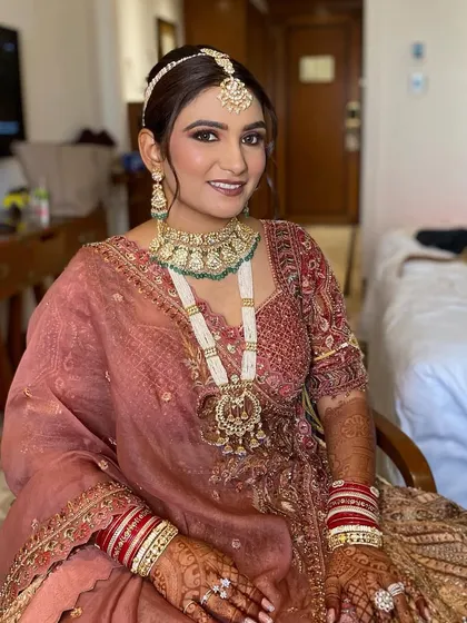 The complete look for Simran. Her Payal Keyal outfit, stunning jewelry, and flawless makeup come together to create a dream bridal look.