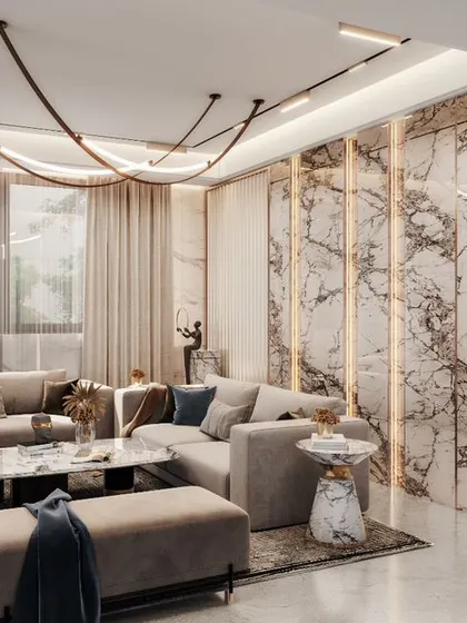 A luxurious living room design concept featuring a marble feature wall, unique track lighting, and a comfortable L-shaped sofa. The glass-enclosed display cabinet adds a touch of elegance.