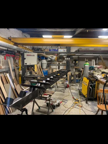 My workshop during the fabrication of a steel centre spine. Every part is measured, cut, and welded by me to ensure a perfect fit on site.