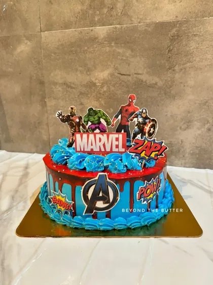 Avengers assemble for a birthday bash. This cake brings together Iron Man, Hulk, Spiderman, and Captain America with a bold Marvel logo and fun comic book sound effects.
